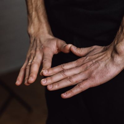 Close-up of hands in a specific yoga mudra.